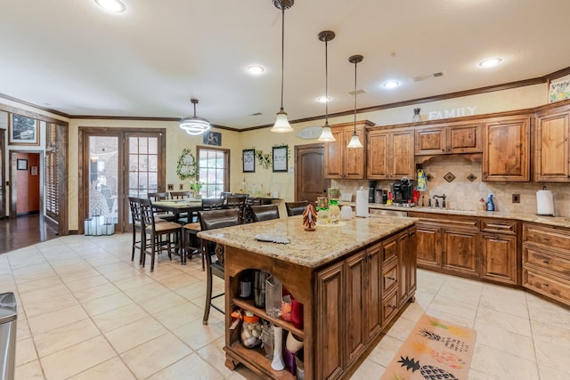 7809 Clearmeadow Dr, Amarillo, TX 79119 - kitchen with open shelves, ornamental molding, decorative backsplash, brown cabinets, and hanging light fixtures