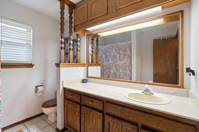 bathroom with vanity, tile patterned flooring, and toilet