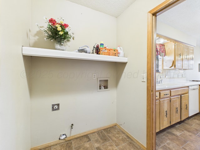 1620 N Nelson St, Pampa, TX 79065 - laundry room featuring washer hookup, electric dryer hookup, gas dryer hookup, stone finish flooring, and a textured ceiling