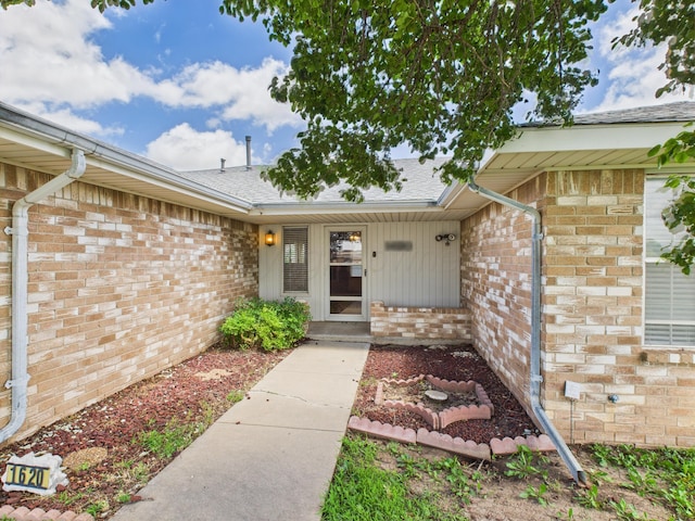 1620 N Nelson St, Pampa, TX 79065 - property entrance featuring brick siding and roof with shingles
