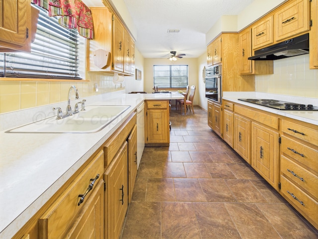 1620 N Nelson St, Pampa, TX 79065 - kitchen featuring under cabinet range hood, black electric stovetop, stainless steel oven, ceiling fan, and light countertops