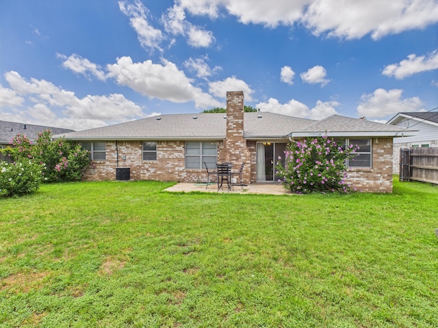 1620 N Nelson St, Pampa, TX 79065 - rear view of house with a patio area, brick siding, and a chimney