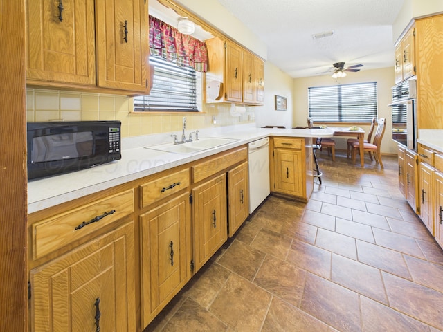 1620 N Nelson St, Pampa, TX 79065 - kitchen featuring black microwave, stainless steel oven, dishwasher, a peninsula, and ceiling fan
