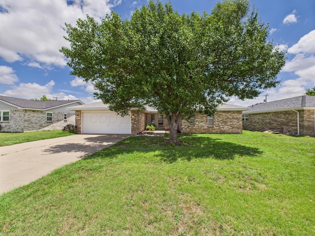 1620 N Nelson St, Pampa, TX 79065 - view of front of property with an attached garage, driveway, a front lawn, and brick siding