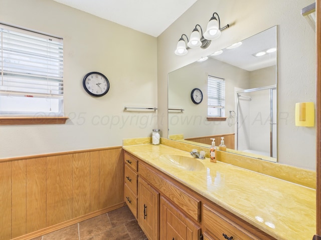 1620 N Nelson St, Pampa, TX 79065 - bathroom featuring a shower stall, vanity, and a wainscoted wall