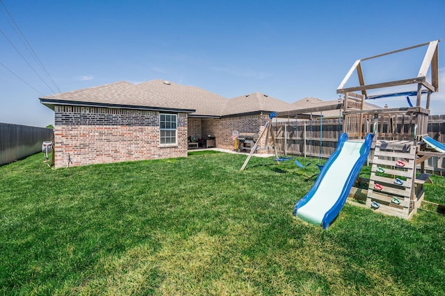 8309 City View Dr, Amarillo, TX 79118 - back of property featuring a playground, brick siding, and a fenced backyard