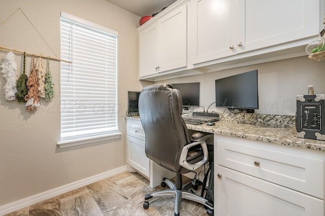 8309 City View Dr, Amarillo, TX 79118 - office area featuring built in desk and light marble finish flooring