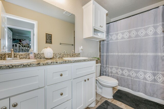 8309 City View Dr, Amarillo, TX 79118 - bathroom with double vanity and a shower with curtain