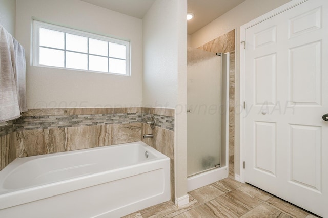 8309 City View Dr, Amarillo, TX 79118 - full bathroom featuring a shower stall and a garden tub