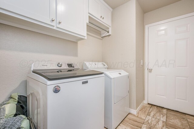 8309 City View Dr, Amarillo, TX 79118 - laundry area featuring cabinet space, washer and clothes dryer, and light marble finish flooring