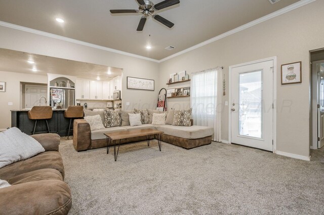8309 City View Dr, Amarillo, TX 79118 - carpeted living room featuring ornamental molding, a ceiling fan, and recessed lighting