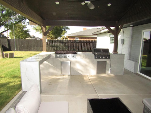 view of patio / terrace with area for grilling and exterior kitchen