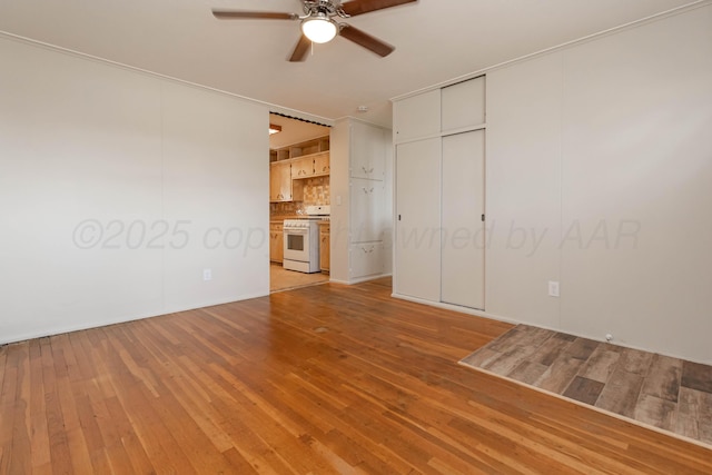 interior space featuring a ceiling fan and light wood-style floors