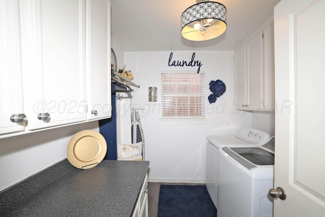 washroom featuring independent washer and dryer and cabinet space