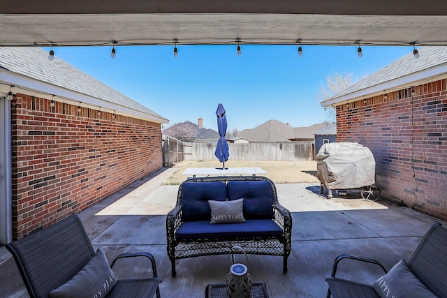 view of patio / terrace with a fenced backyard and area for grilling