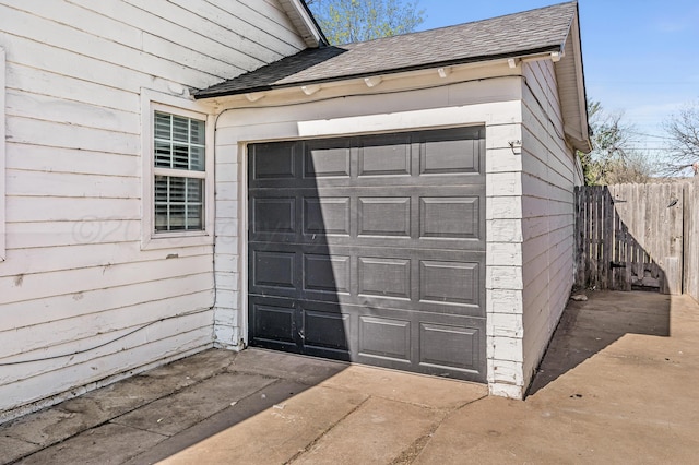 garage featuring fence