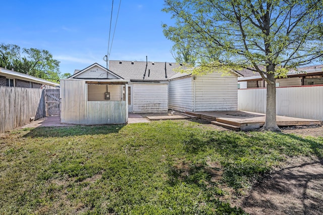 view of yard featuring a fenced backyard and a wooden deck