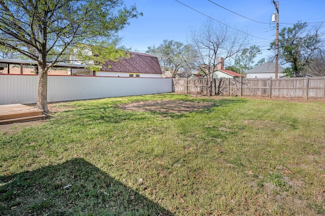 view of yard with a fenced backyard