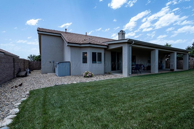 1006 Pinot Blvd, Amarillo, TX 79124 - rear view of house with a chimney, a patio area, stucco siding, and a tile roof
