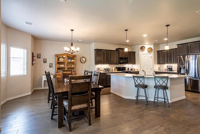 1006 Pinot Blvd, Amarillo, TX 79124 - dining room featuring a chandelier, dark wood finished floors, and recessed lighting