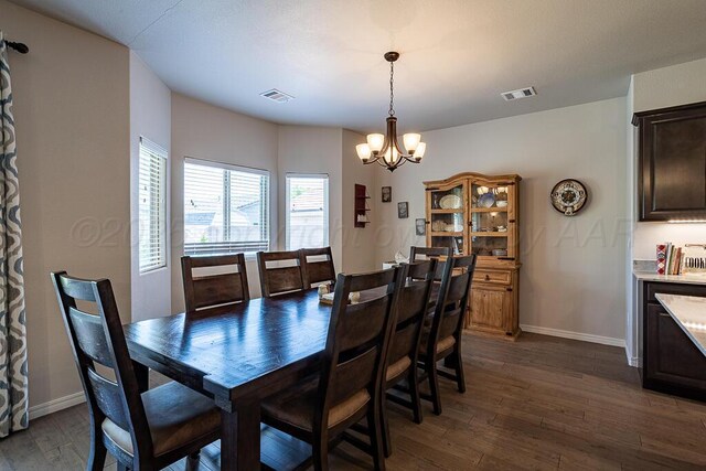 1006 Pinot Blvd, Amarillo, TX 79124 - dining space featuring a chandelier and dark wood finished floors