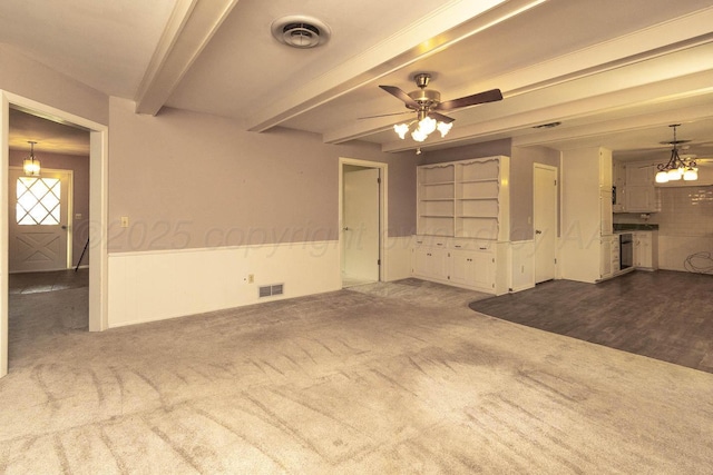 4903 Princeton St, Amarillo, TX 79109 - empty room featuring beamed ceiling, carpet floors, wainscoting, a chandelier, and ceiling fan