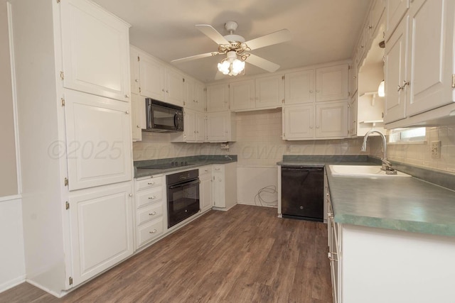 4903 Princeton St, Amarillo, TX 79109 - kitchen featuring black appliances, a sink, dark wood finished floors, and white cabinetry