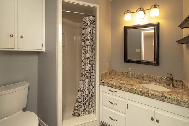 4903 Princeton St, Amarillo, TX 79109 - bathroom featuring vanity, toilet, and a shower stall