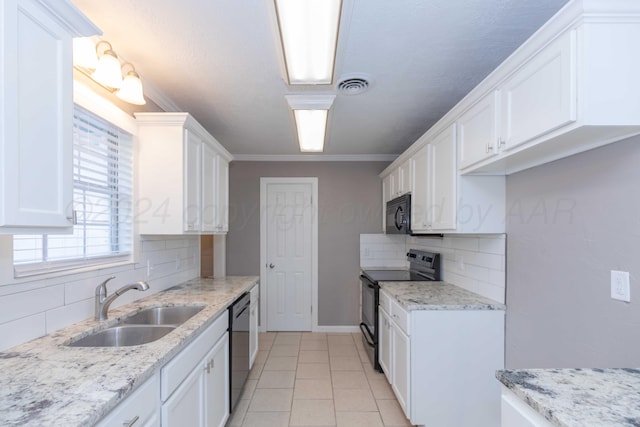 kitchen featuring white cabinets, backsplash, sink, and black appliances