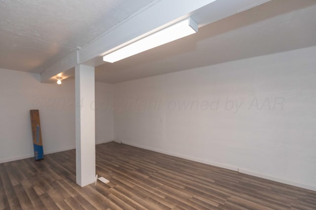 basement featuring dark wood-type flooring