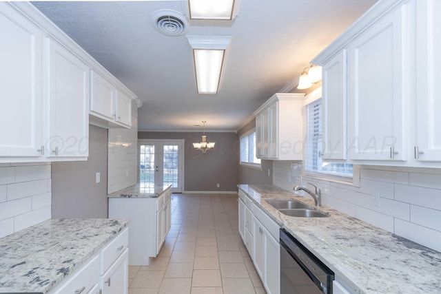 kitchen with white cabinets, dishwasher, a healthy amount of sunlight, and pendant lighting