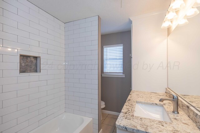 full bathroom featuring tile patterned floors, vanity, toilet, and tiled shower / bath combo