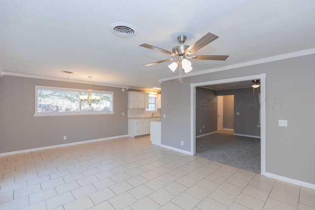 unfurnished living room with sink, light tile patterned floors, and ornamental molding