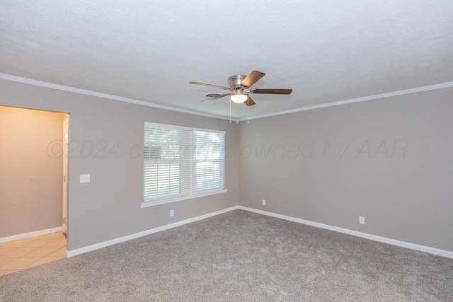 empty room featuring light carpet, ceiling fan, a textured ceiling, and ornamental molding