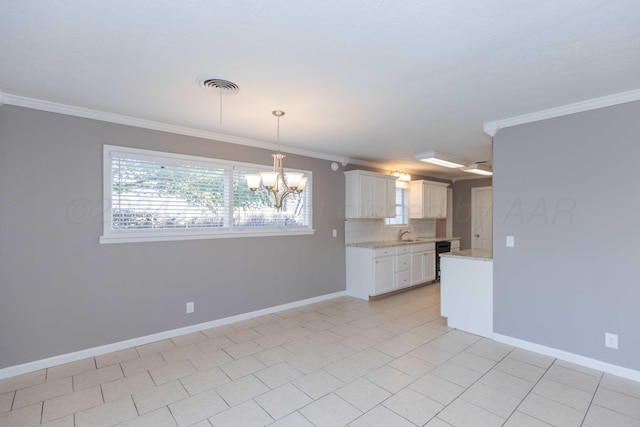 kitchen with white cabinets, pendant lighting, backsplash, and ornamental molding