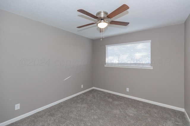 empty room featuring ceiling fan, carpet floors, and a textured ceiling