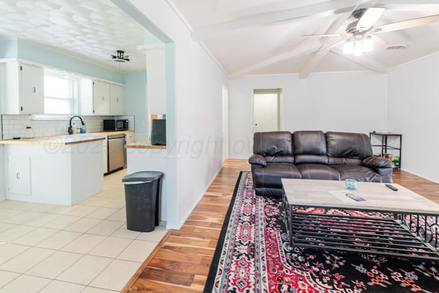 5210 S Milam St, Amarillo, TX 79110 - living area with light wood-style floors and a ceiling fan
