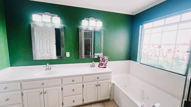 bathroom with ornamental molding, a sink, double vanity, and a tub with jets