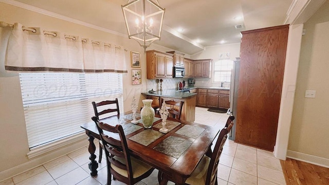 dining area with a chandelier, visible vents, baseboards, and ornamental molding