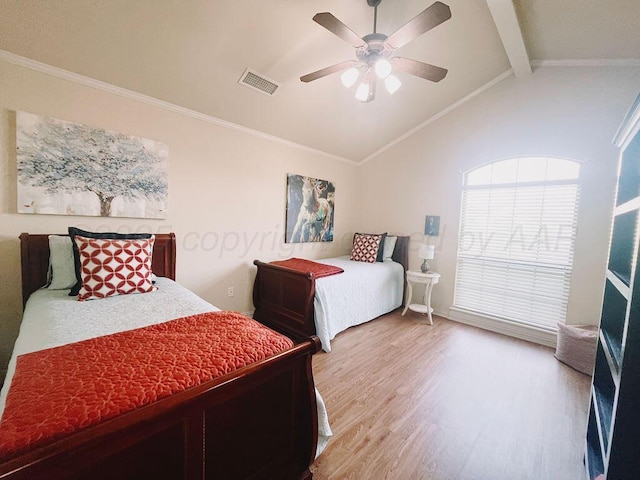 bedroom with vaulted ceiling with beams, visible vents, light wood-style floors, and ornamental molding