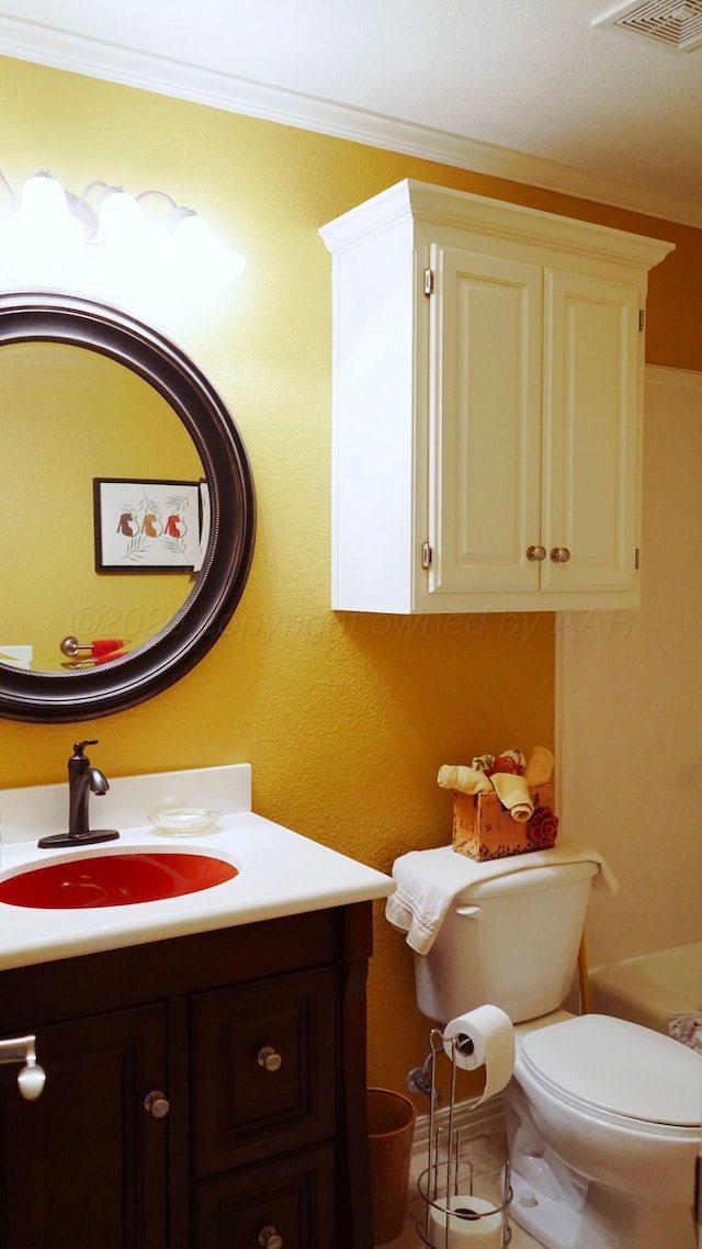 bathroom featuring crown molding, visible vents, toilet, and vanity