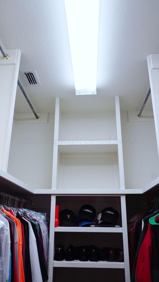 walk in closet with visible vents