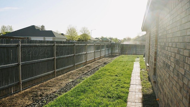 view of yard featuring a fenced backyard