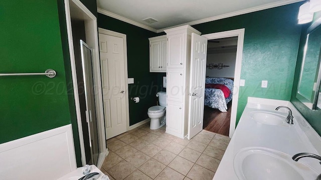 ensuite bathroom with tile patterned flooring, visible vents, a sink, and toilet