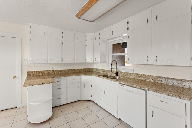 kitchen featuring white cabinets and white dishwasher