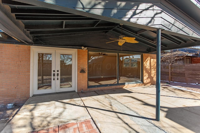 view of patio / terrace with ceiling fan, fence, and french doors