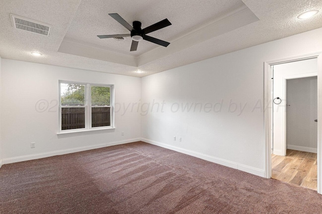 2607 15th Ave, Canyon, TX 79015 - carpeted empty room with a tray ceiling, a textured ceiling, ceiling fan, baseboards, and recessed lighting