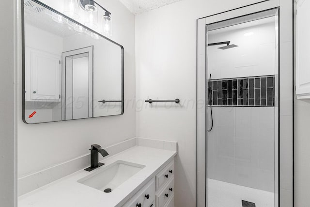 2607 15th Ave, Canyon, TX 79015 - bathroom with a stall shower, vanity, and a textured ceiling