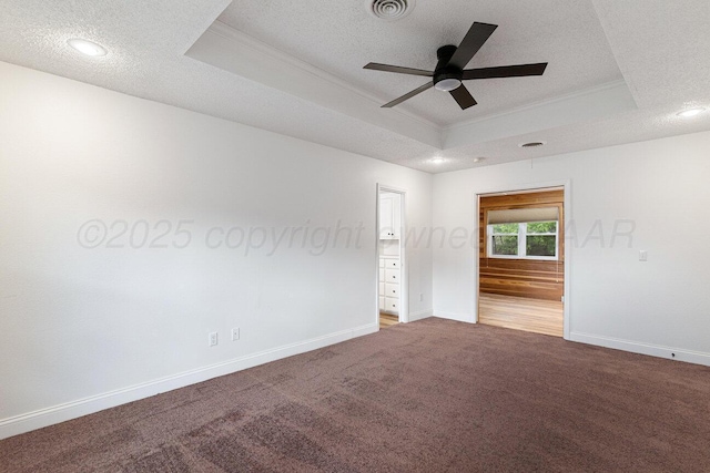 2607 15th Ave, Canyon, TX 79015 - carpeted spare room with a tray ceiling, a textured ceiling, crown molding, a ceiling fan, and baseboards