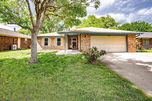 2607 15th Ave, Canyon, TX 79015 - ranch-style house with a garage, brick siding, concrete driveway, and a front lawn